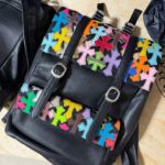 Colored leather and black leather backpacks